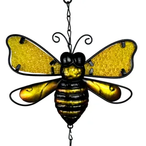 Close-up detail of the handmade stained glass bee hanging ornament with black metal frame.