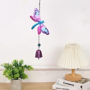 Metal dragonfly wind chime detail shot, exquisite glass art hanging decor for home.