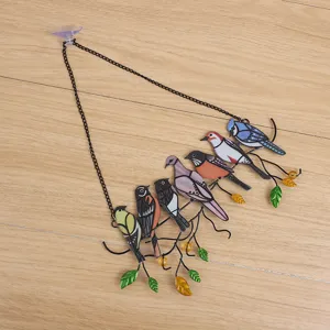 Stained glass metal bird window hanging decor detail, colorful art branch pendant with suction cup.