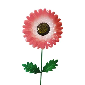 Metal garden flower stake close up detail, pink decorative bloom ornament with green stem for yard.