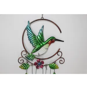 Metal hummingbird wind chime detail shot, colorful glass and iron art hanging decoration.