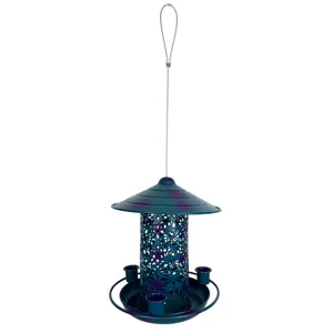 Hanging metal bird feeder with floral cutouts, outdoor garden decor and wild bird feeding station.