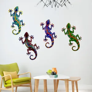 Scene showing vibrant colorful metal gecko wall art hanging on a clean white living room wall decor detail.
