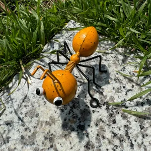 Cute metal ant ornament for garden decor, yellow spotted outdoor metal insect sculpture.