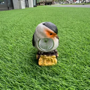 Outdoor solar bird light resin garden lawn ornament for courtyard landscape decor.