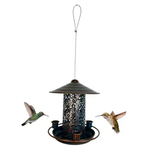 Metal bird feeder detail view, outdoor hanging iron art decoration for garden and yard use.