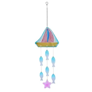 Glass wind chime detail showing the sailboat motif, hanging fish pendants, and starfish accent.