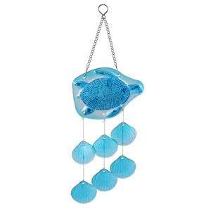 Detailed close-up of blue glass sea turtle and shell wind chime pendant hanging decoration.