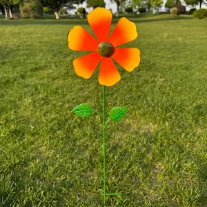 Metal flower garden stake outdoor lawn decor detail view, bright orange flower with green stem.