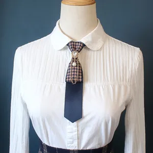 Collegiate style houndstooth necktie with pearl chain and rhinestone accent for daily wear.