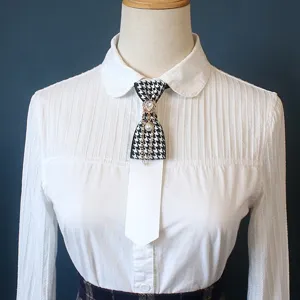 Houndstooth pre-tied necktie with pearl and rhinestone chain, retro style collar accessory.