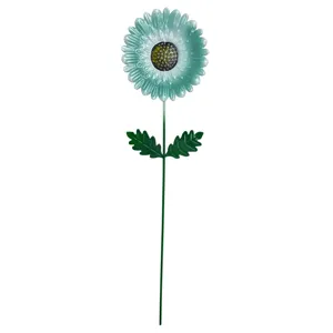 Metal flower garden stake detail showing vibrant green petals and stem for outdoor yard decor.