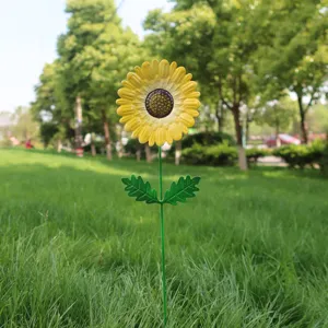 Metal sunflower garden stake for outdoor lawn yard decoration and garden landscape design detail.
