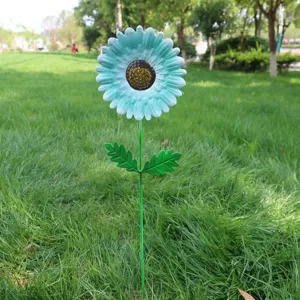 Metal flower garden stake outdoor lawn decor, vibrant turquoise bloom plant stake for yard art.