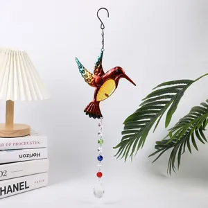 Metal hummingbird suncatcher wind chime with crystal pendants for garden home window decor.