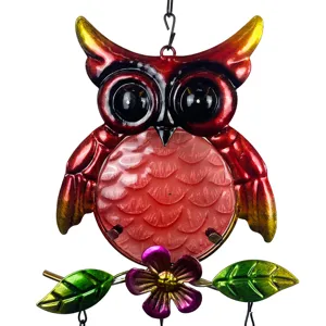 Detailed view of the colorful metal and glass owl wind chime featuring vibrant painted details.