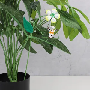 Metal flower garden stake detail view, cute swing cow plant pot insert for micro landscape decoration.