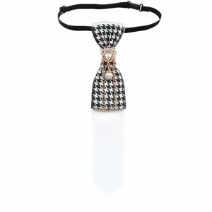Details of the pre-tied houndstooth necktie featuring rhinestones, pearl chain and white accent.