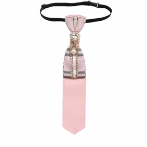 Close-up detail of the pink plaid pre-tied necktie featuring rhinestone and pearl chain.