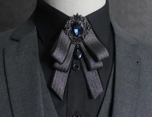 Close-up of men vintage layered bow tie with blue rhinestone crystal brooch for formal suit suits.