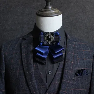 Men's dark blue satin double-layer bow tie wedding suit collar flower main view display.