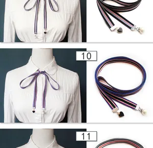 Detailed view of women striped ribbon tie, cute collar bow with heart and pearl pendant.