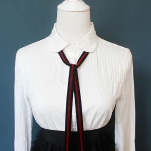 Elegant women neck ribbon tie with classic striped design for stylish professional shirts.