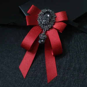 Elegant red ribbon bow tie with sparkling rhinestone brooch for men stage performance.
