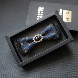 Elegant men's blue jacquard bow tie with sparkling rhinestone center, perfect for formal events.
