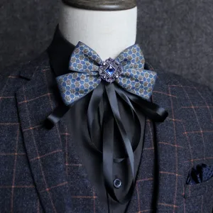 British style exaggerated men's bow tie cravat with blue jewel for groom and wedding host.
