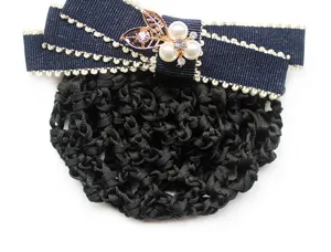 Detailed view of professional hair net with navy bow, pearls and rhinestones design.
