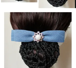 Detailed view of professional hair net clip with blue bow and pearl rhinestone flower design.