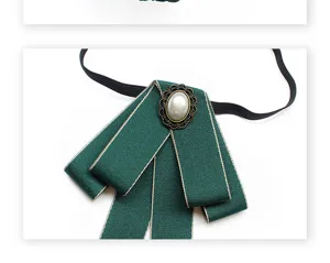 Dark green ribbon bow tie for women professional shirt accessory with vintage pearl brooch detail.