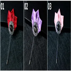 Detailed view of exquisite vintage lapel pins featuring colorful satin fabric flower designs.
