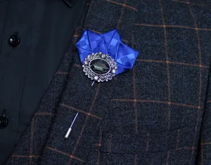 Elegant men's suit lapel pin with blue folded ribbon and vintage crystal brooch design.