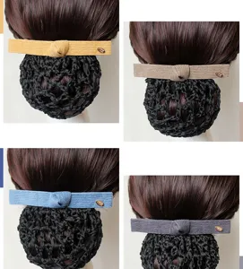 Detailed view of professional hair net bun cover with corduroy bow clip, four colors available.