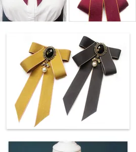 Detailed view of Japanese JK style ribbon bow tie with vintage brooch and pearl pendant.