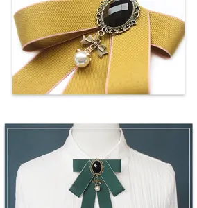 Elegant Japanese JK uniform bow tie collar brooch with vintage black gem and pearl pendant.