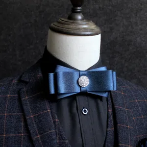 Elegant blue satin bow tie for men with sparkling rhinestone center, ideal for formal suits.
