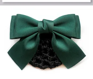 Detailed close-up of dark green satin hair bow bun cover, professional net accessory.