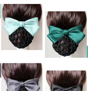 Detail view of professional ribbon bow hair net, showcasing fine fabric and net structure.