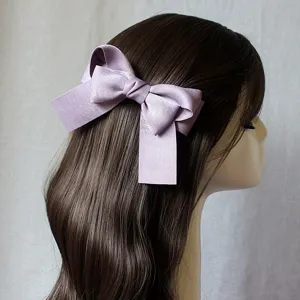 Lavender satin bow hair clip for elegant hairstyles, charming hair accessory for women daily wear.