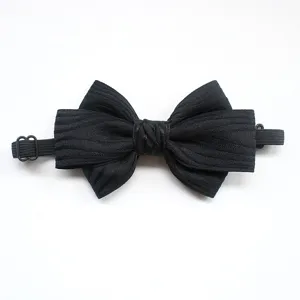 Detailed close-up of a classic black striped bow tie with adjustable elastic strap for kids.
