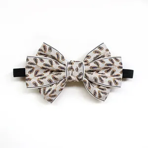 Children bow tie detail, elegant leaf pattern fabric, classic collar accessory for kids.