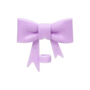 Closeup of purple glitter bow silicone straw cover detail for 10mm cups. Cute cup accessory.