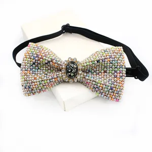 Rhinestone crystal bow tie with vintage gemstone center, elegant men wedding party wear detail.