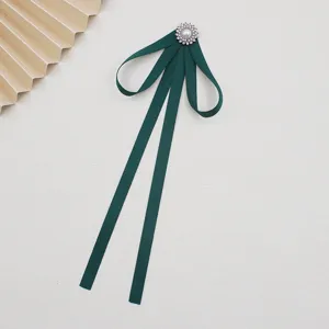 Dark green JK uniform bow tie detail, elegant ribbon collar accessory for women.