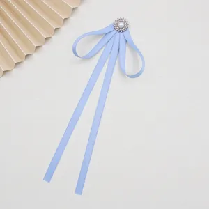 Light blue ribbon bow tie for JK uniform, featuring elegant pearl rhinestone brooch accessory.