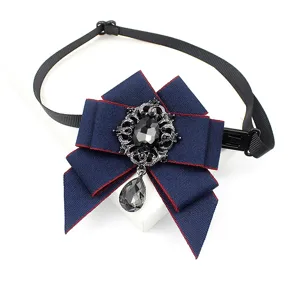 Dark blue ribbon bow tie detail with vintage rhinestone crystal pendant for kids party.