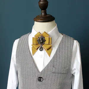 Kids vintage bow tie brooch set with rhinestone pendant and herringbone vest for boys and girls.